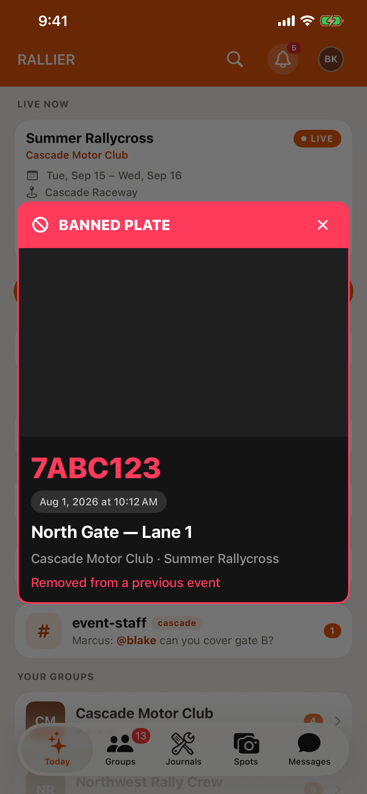 A flagged-plate alert appearing in the RALLIER app when a banned plate is spotted at an event